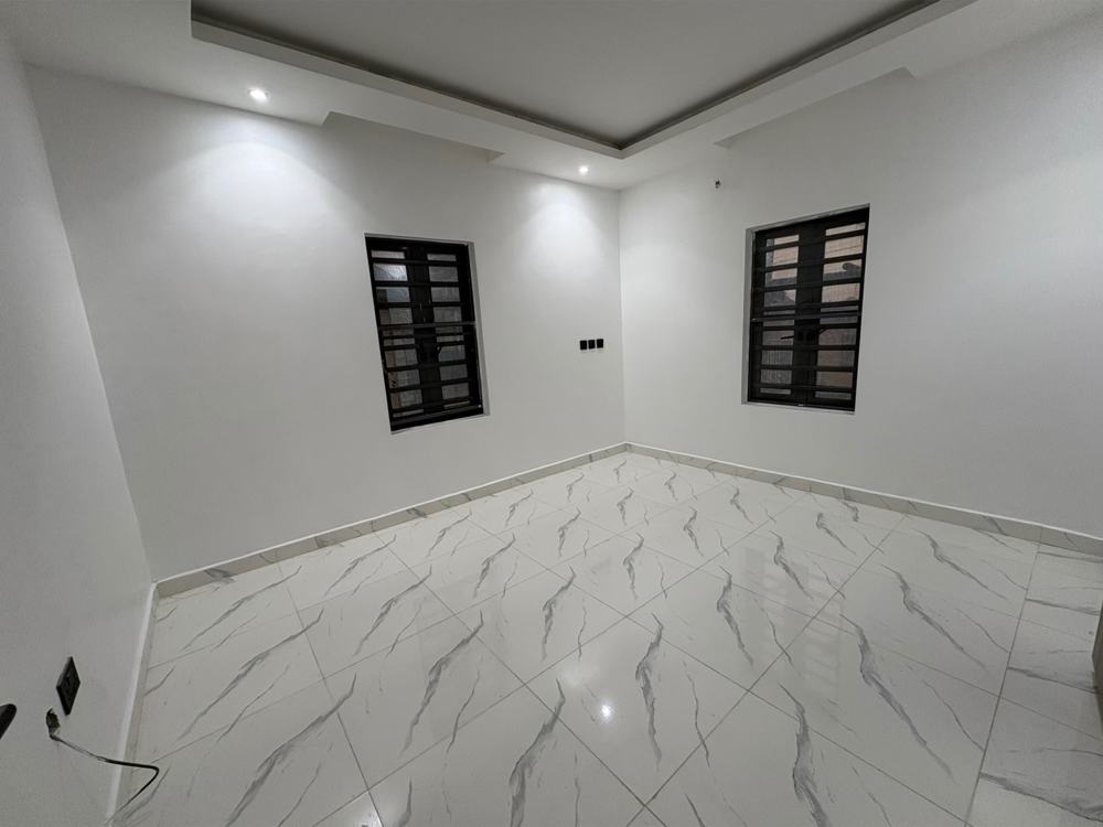 Bedroom with two windows and marble floor